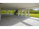 Spacious covered patio with concrete flooring and access to a grassy backyard at 2316 S 46Th St, Tampa, FL 33619