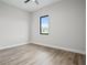 Simple bedroom with wood-look floors and a large window at 2316 S 46Th St, Tampa, FL 33619