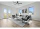 Comfortable living room with grey sofa and two armchairs at 2316 S 46Th St, Tampa, FL 33619