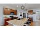 Stylish kitchen featuring granite counters and an island with seating at 2616 Garden Plum Pl, Odessa, FL 33556