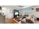 Cozy living room with sectional sofa and a large TV stand at 2616 Garden Plum Pl, Odessa, FL 33556