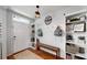 Bright entryway with built-in bench, shelves, and hooks at 2616 Garden Plum Pl, Odessa, FL 33556