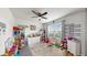 Playroom with toys, books, and a ceiling fan at 2616 Garden Plum Pl, Odessa, FL 33556