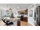 Spacious kitchen with granite countertops, modern cabinetry, and an island at 2616 Garden Plum Pl, Odessa, FL 33556