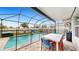 Enjoy dining al fresco by the screened pool at 2616 Garden Plum Pl, Odessa, FL 33556