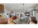 Eat-in kitchen with granite counters, ample cabinetry, and island at 2616 Garden Plum Pl, Odessa, FL 33556