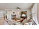 Living room with gray sectional sofa and entertainment center at 2616 Garden Plum Pl, Odessa, FL 33556