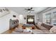 Living room with sectional sofa, coffee table, and built-in shelving at 2616 Garden Plum Pl, Odessa, FL 33556