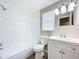 Clean bathroom with white vanity, tub, and shower at 1709 E Sitka St, Tampa, FL 33604