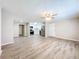 Bright living room with hardwood floors and ceiling fan at 1709 E Sitka St, Tampa, FL 33604