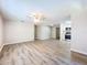Open living room and kitchen area with wood-look floors at 1709 E Sitka St, Tampa, FL 33604