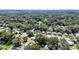Wide aerial view of neighborhood with lush tree coverage at 1709 E Sitka St, Tampa, FL 33604