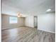 Living room featuring wood-look floors and a ceiling fan at 1709 E Sitka St, Tampa, FL 33604