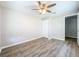 Bedroom with wood-look floors and ceiling fan at 1709 E Sitka St, Tampa, FL 33604