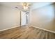 Spacious bedroom with wood-look floors and access to another room at 1709 E Sitka St, Tampa, FL 33604