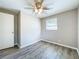 Well-lit bedroom featuring wood-look floors and a window at 1709 E Sitka St, Tampa, FL 33604