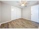 Bright bedroom with wood-look floors and ceiling fan at 1709 E Sitka St, Tampa, FL 33604