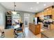 Well-equipped kitchen with stainless steel appliances and light wood cabinets at 108 Aberdeen Pond Dr, Apollo Beach, FL 33572