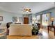 Bright living room with hardwood floors, light blue walls, and ample natural light at 108 Aberdeen Pond Dr, Apollo Beach, FL 33572