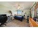 Bedroom with a desk, exercise bike, and window at 5806 Candytuft Place, Land O Lakes, FL 34639