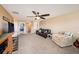 Spacious bonus room with plush seating and a ceiling fan at 5806 Candytuft Place, Land O Lakes, FL 34639