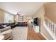 Bright living room with large sectional sofa and hardwood flooring at 5806 Candytuft Place, Land O Lakes, FL 34639