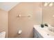 Small half bathroom with light blue vanity and a toilet at 5806 Candytuft Place, Land O Lakes, FL 34639