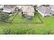 Aerial view of house, showcasing a fenced backyard and surrounding homes at 5806 Candytuft Place, Land O Lakes, FL 34639