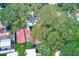 Aerial view showing the property, large trees, and a shed at 5104 S 66Th St, Tampa, FL 33619