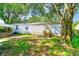 Mobile home exterior with steps leading to the entrance and a large tree nearby at 5104 S 66Th St, Tampa, FL 33619