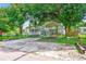 Home with carport and a large grassy area at 5104 S 66Th St, Tampa, FL 33619