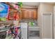 Functional laundry room with washer, dryer, and ample cabinetry at 5104 S 66Th St, Tampa, FL 33619
