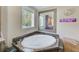Relaxing bathroom with corner soaking tub and large mirror at 5104 S 66Th St, Tampa, FL 33619