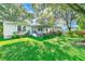 Charming single story home with a spacious front yard and mature trees at 5104 S 66Th St, Tampa, FL 33619