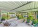 Covered patio with seating area and views of the backyard at 5104 S 66Th St, Tampa, FL 33619