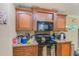 Well-equipped kitchen with microwave and stovetop at 5104 S 66Th St, Tampa, FL 33619