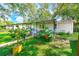 Cozy home with covered porch and well-manicured landscaping at 5104 S 66Th St, Tampa, FL 33619
