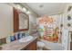 Bathroom with shower/tub combo and decorative shower curtain at 5104 S 66Th St, Tampa, FL 33619