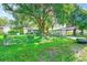 Ranch style home with a large fenced yard and mature trees at 5104 S 66Th St, Tampa, FL 33619