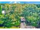 Property with large trees and a carport at 5104 S 66Th St, Tampa, FL 33619