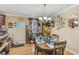 Charming dining room with wooden table and floral centerpiece at 5104 S 66Th St, Tampa, FL 33619