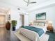 Main bedroom with sliding barn door and modern decor at 920 N Osceola Ave # 703, Clearwater, FL 33755