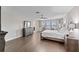 Spacious main bedroom with large bed and en-suite bathroom access at 19065 Malinche Loop, Spring Hill, FL 34610