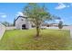 Large backyard featuring a grassy area and mature trees at 19065 Malinche Loop, Spring Hill, FL 34610