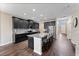 Open concept kitchen with island, granite countertops, and stainless steel appliances at 19065 Malinche Loop, Spring Hill, FL 34610
