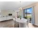 Open concept dining area with view of living room and backyard at 19065 Malinche Loop, Spring Hill, FL 34610