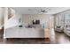 Living room with sectional sofa and view of kitchen at 19065 Malinche Loop, Spring Hill, FL 34610