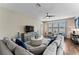 Relaxing living room featuring sectional sofa and hardwood floors at 19065 Malinche Loop, Spring Hill, FL 34610