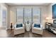 Cozy sitting area with two armchairs and hardwood floors at 19065 Malinche Loop, Spring Hill, FL 34610