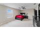 Cozy bedroom with a double bed, nightstand, and ceiling fan at 19065 Malinche Loop, Spring Hill, FL 34610